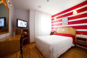 Postel nebo postele na pokoji v ubytování Hotel Río Cabia
