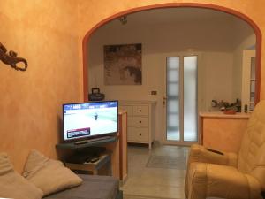 TV a/nebo společenská místnost v ubytování La Casa di Zoe