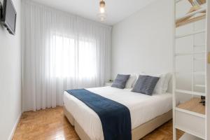 Un pat sau paturi într-o cameră la Casas da Praia
