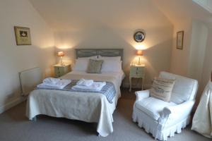 Un pat sau paturi într-o cameră la Abbey View