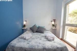 Postel nebo postele na pokoji v ubytování B&B Villa Eleonora