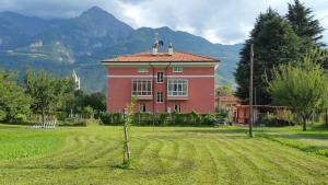 a red house with two birds on top of it at Al borgo di Sant'Orso - CIR 0342 in Aosta