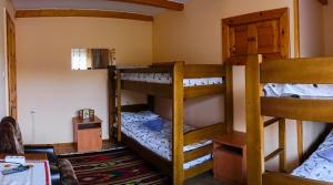 a room with three bunk beds in a house at Guest house Dvir Pysanka in Kosiv +77 photos