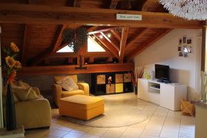 a living room with a couch and a tv at Villetta relax in Aosta