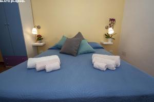 Postel nebo postele na pokoji v ubytování B&B Villa Eleonora