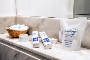 a counter with a basket and a bag of toiletries at Hotel Castellano I in Salamanca +14 photos