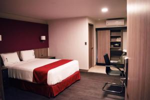 Postel nebo postele na pokoji v ubytování Hotel Ht Ole