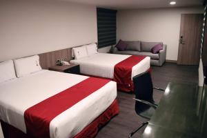 Postel nebo postele na pokoji v ubytování Hotel Ht Ole + 34 fotografií