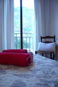 a bedroom with a large bed and a large window at Habitación La Luz in Granada