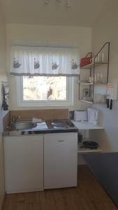 A kitchen or kitchenette at Vatnsás 10