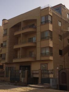 an apartment building with balconies on the side of it at 112 AUC Residence in Cairo