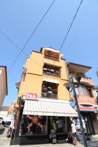 a building with a store in front of it at Vila Tea Petrusevski in Ohrid