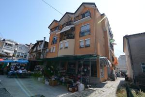 a building with a store in front of it at Vila Tea Petrusevski in Ohrid