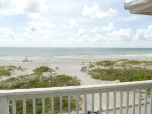 a view of the beach from the balcony of a condo at Sand Glo Villas in Clearwater Beach