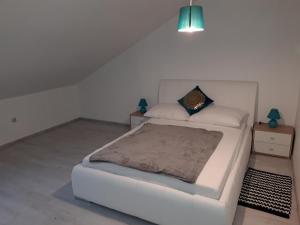 Posteľ alebo postele v izbe v ubytovaní Apartman Mohenski