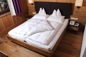 Postel nebo postele na pokoji v ubytování Hotel Kirchenwirt
