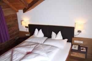 Postel nebo postele na pokoji v ubytování Hotel Kirchenwirt