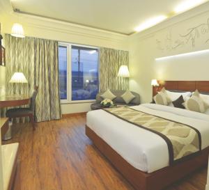 Postel nebo postele na pokoji v ubytování Hotel Regent Grand