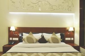 Postel nebo postele na pokoji v ubytování Hotel Regent Grand