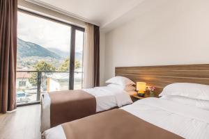 Rúm í herbergi á Mount Inn Kazbegi