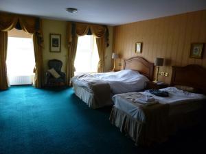 A bed or beds in a room at Corbett Court