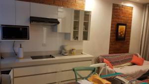 a small kitchen with a sink and a counter top at Apartment Acogedor in Huanchaco