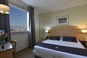 Postel nebo postele na pokoji v ubytování Tulip Inn Turin West Rivoli + 27 fotografií