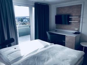 Llit o llits en una habitació de Hotel an der Burgschänke