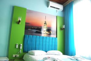 Postel nebo postele na pokoji v ubytování HOTEL MİKLAGORD