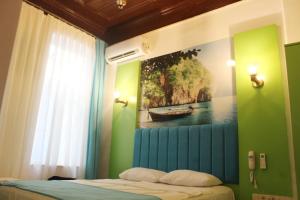 Postel nebo postele na pokoji v ubytování HOTEL MİKLAGORD