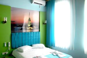 Postel nebo postele na pokoji v ubytování HOTEL MİKLAGORD