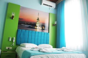 Postel nebo postele na pokoji v ubytování HOTEL MİKLAGORD