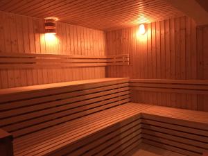 a sauna with two benches and lights in it at Pension Neuerbe in Erfurt