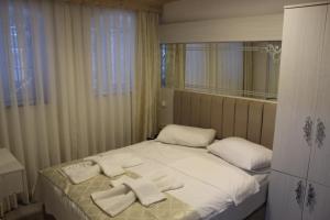 Postel nebo postele na pokoji v ubytování HOTEL MİKLAGORD