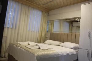 Postel nebo postele na pokoji v ubytování HOTEL MİKLAGORD