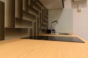 A kitchen or kitchenette at Electra & Myrto Apartments