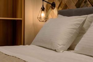 A bed or beds in a room at Electra & Myrto Apartments