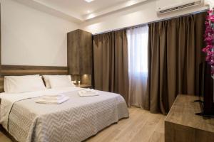 Posteľ alebo postele v izbe v ubytovaní Electra & Myrto Apartments + 18 fotografií