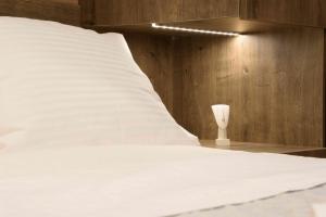 A bed or beds in a room at Electra & Myrto Apartments
