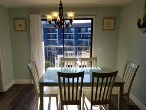 a dining room with a table and chairs and a window at Myrtle Beach Resort- Unit A 428 in Myrtle Beach