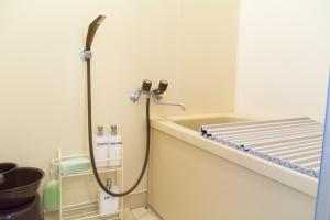 a shower in a bathroom with a tub at Mark's HOME in Maebashi +34 photos