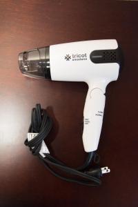 a white electric hair dryer sitting on a table at Mark's HOME in Maebashi