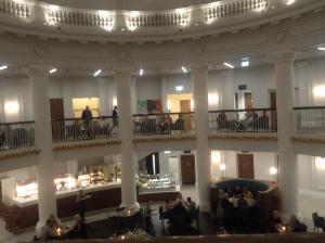 a large building with people on balconies and a lobby at The Pines Guest House in Whitley Bay