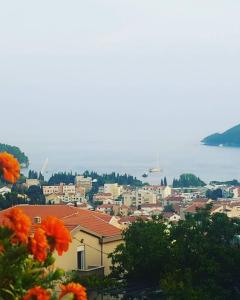 a view of a city with orange flowers at Georgijevic Room & Apartments in Budva +3 photos