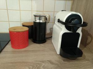 a toaster and coffee maker sitting on a counter at Paradies Für Zwei in Frauenkirchen