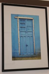 a painting of a blue door on a wall at shelley affittacamere in La Spezia