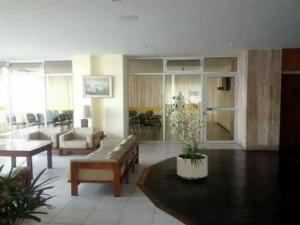 a living room with a couch and a table at Playa Club in Miramar