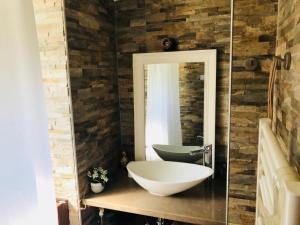 a bathroom with a white sink and a mirror at CosyStudio2 Site du Futuroscope in Jaunay-Marigny