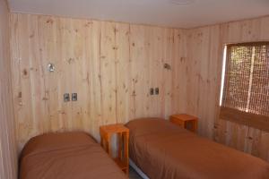 Voodi või voodid majutusasutuse Lodge Colbún toas
