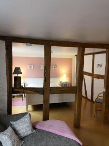 a bedroom with a bed and a couch in a room at Ferienwohnung-Hallebach in Zell an der Mosel